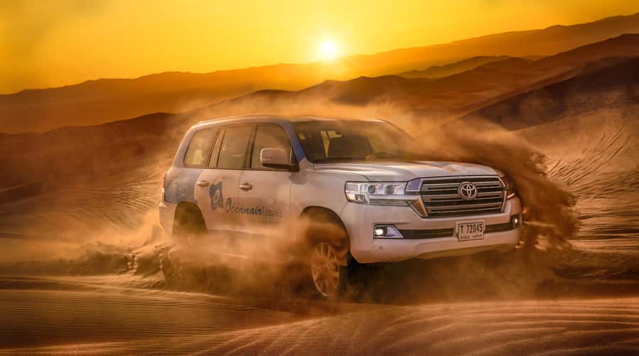Dubai: Helicopter Ride, Desert Safari, Camels & Refreshments - Quad biking across the red dunes