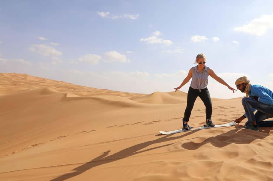 Dubai: Helicopter Ride, Desert Safari, Camels & Refreshments - Sandboarding, photos, and a short camel ride