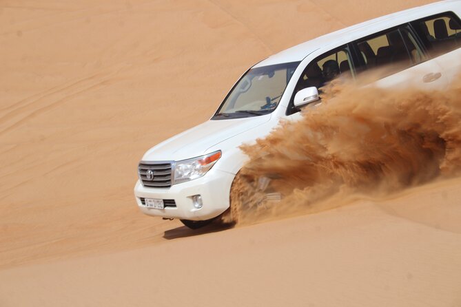 Dubai: Jeep Desert Safari, Camel Ride, and Quad Bike Tour - Sandboarding and photos on the red slopes
