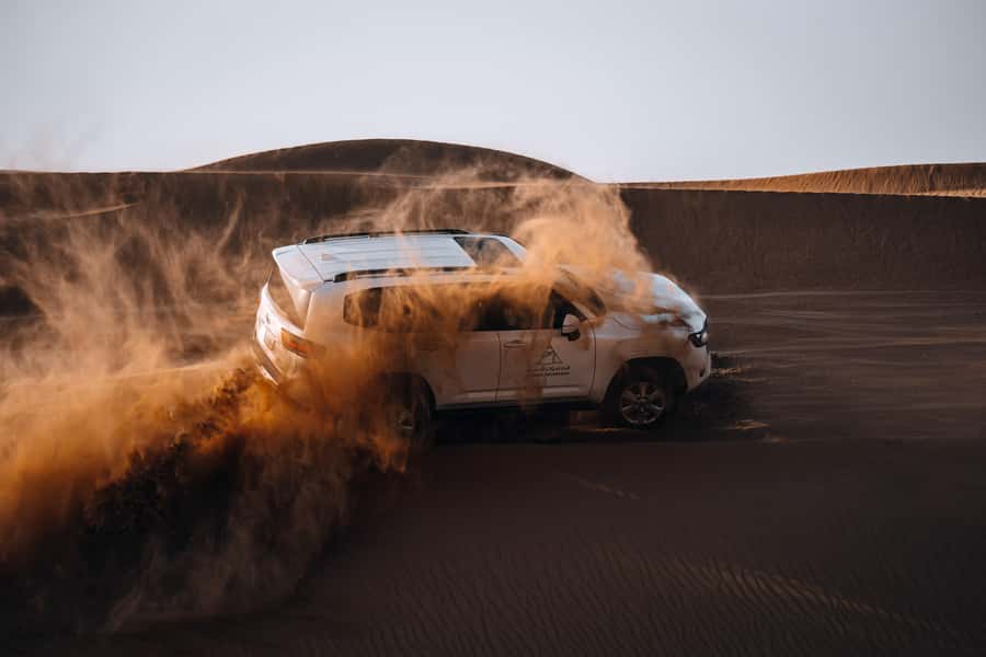 Dubai: Premium Desert Safari, Camel Ride, BBQ & Sandboarding - Sunset stops turn the desert into a photo studio
