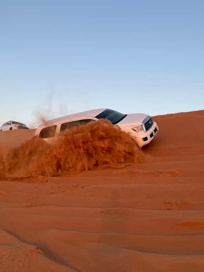 Dubai: Premium Red Dune Safari with Sandboarding & BBQ - Sandboarding and the desert photo stop