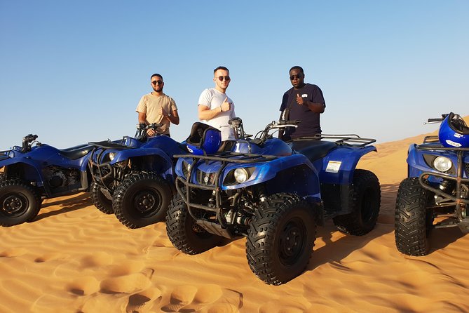 Dubai: Quad Bike Safari, Camels, & Camp with BBQ Dinner - A Bedouin-style camp after sunset