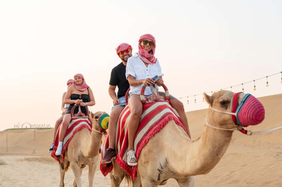 Dubai: Red Dune Desert Safari, Quad Bike, Camels, and BBQ - Dune bashing across steep red sand