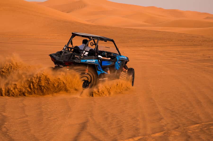 Dubai: Red Dune Desert Safari, Quad Bike, Camels, and BBQ - Hotel pickup and the drive toward the red dunes