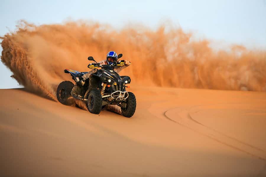 Dubai: Red Dune Safari, Quad Bike, Camel Ride, BBQ Dinner - Sandboarding and sunset photos in the open dunes