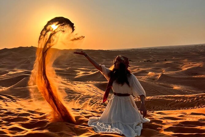 Dubai Red Dune Safari with Bedouin BBQ Dinner & Hotel Transfers - Sandboarding and sunset photographs
