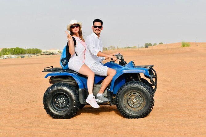 Dubai: Red Dunes Desert Safari, Camel ride, Sandboard, Quad Bike - Sandboarding and a desert sunset