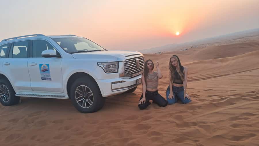 Dubai: Red Dunes Desert Safari with Premium Camp BBQ & Shows - Camel ride, falcon photos, and sandboarding
