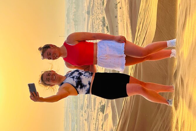 Dubai Sunset Red Dune Desert Safari, Sandboarding and Camel Ride - Sandboarding on the dunes