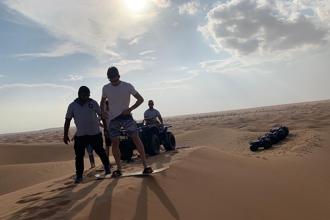 Dubai: Unique SUNSET Quad Bike Red Dunes Safari - Dinner and entertainment at the desert camp