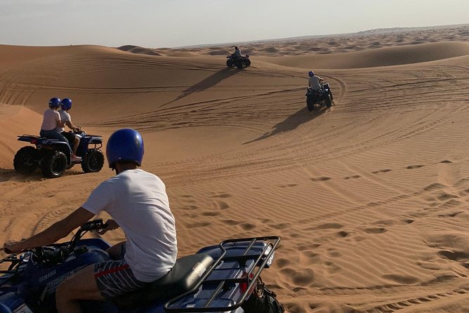 Dubai: Unique SUNSET Quad Bike Red Dunes Safari - Booking, cancellations and weather