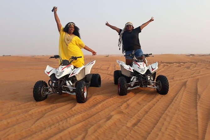 Evening Red Dunes Safari with Quad Biking, BBQ Dinner & LiveShows - Quad biking across the sand