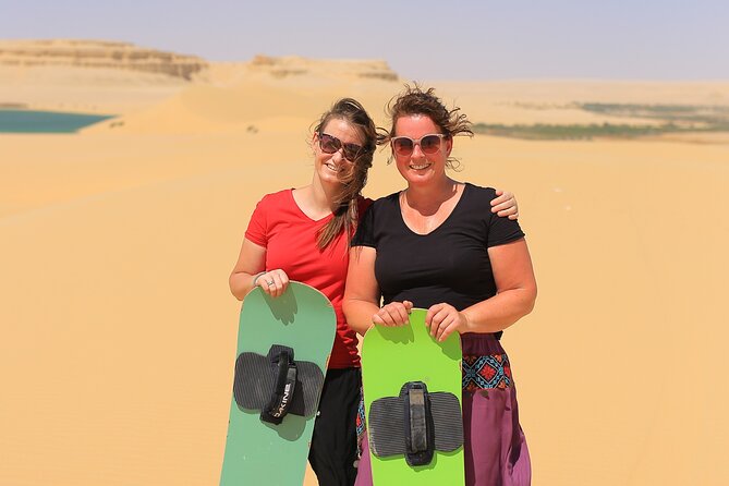 From Cairo 4x4 Safari, Camel Ride, Magic Lake, Waterfalls & Lunch - Sandboarding on soft yellow dunes