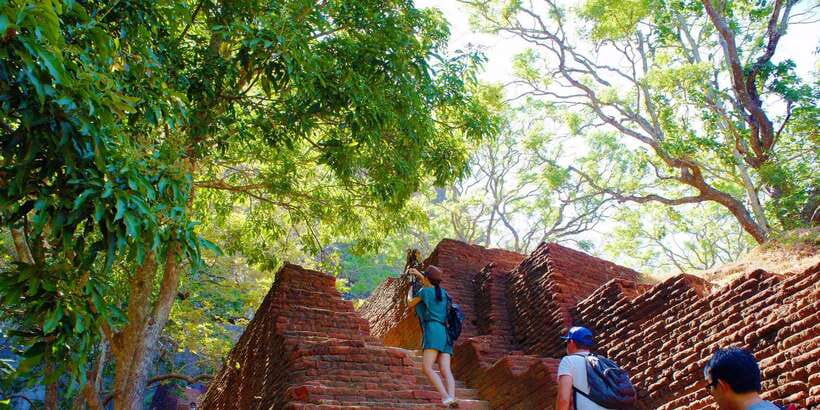 From Negombo: Sigiriya and Dambulla Day Trip and Safari - Dambulla Cave Temple before the worship closure