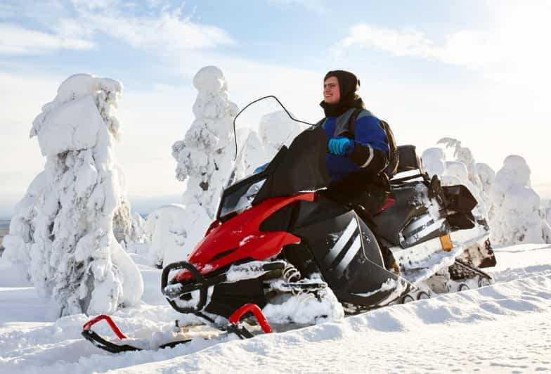 From Rovaniemi: 2-Hour Snowmobile Safari - Following the guide across icy trails
