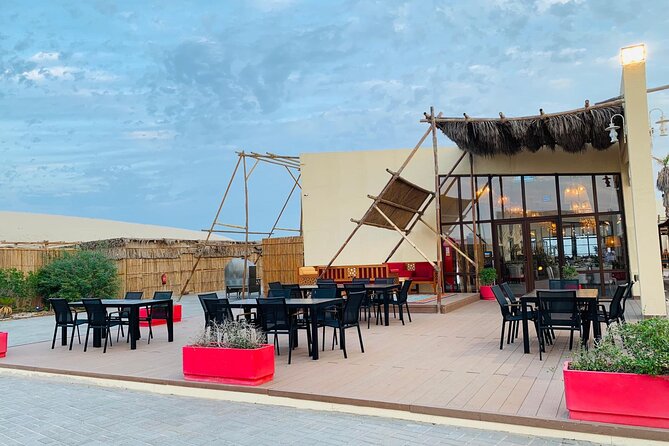 Full-day Qatar desert safari: dune bashing, sandboarding, camels - From Doha to Sealine, preparing for the sand