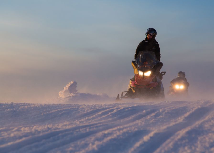 Levi: Evening Snowmobile Safari - Night trails, frozen lakes, and snow-laden trees