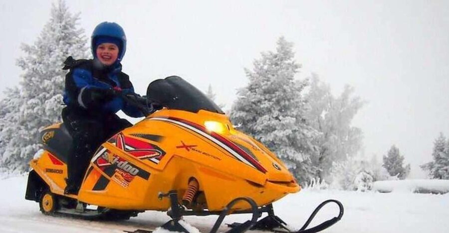 Levi: Lapland Family Snowmobile Safari - Riding through snowy Lapland