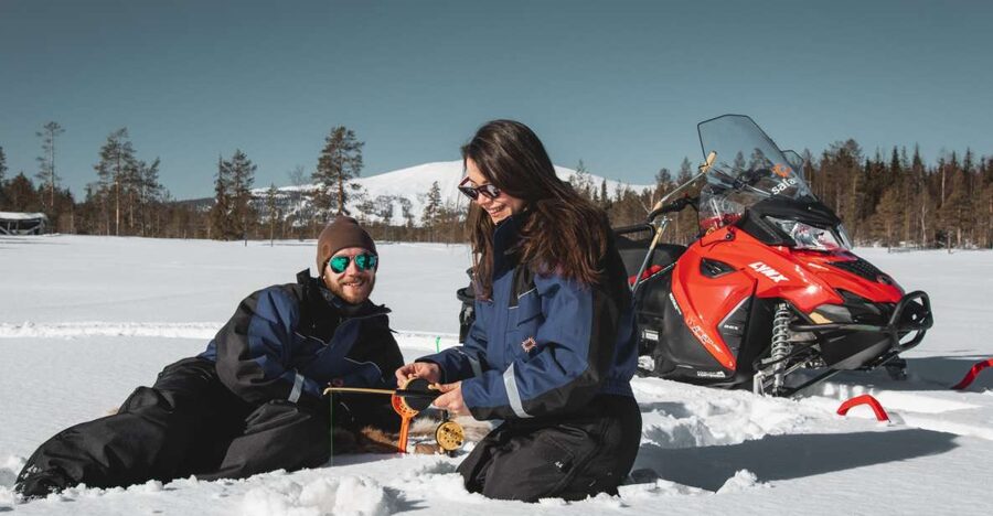 Levi: Snowmobile Safari with Ice Fishing and Outdoor Lunch - Riding across frozen lakes and forest trails