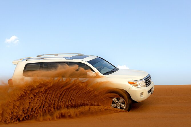 Morning Desert Safari, Quad Bike, Sandboard and Camel Ride - Dune bashing across the red sand
