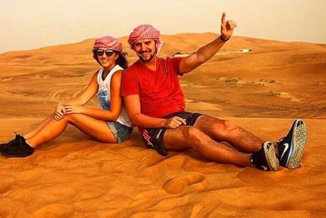 Morning Desert Safari with Quad Bike, Camel Ride & Sandboarding - Sandboarding after the big ride