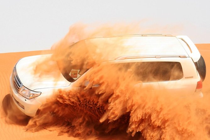 Morning Dubai Desert Safari with Sand boarding and Camel Ride - Dune Bashing Across the Rolling Sand