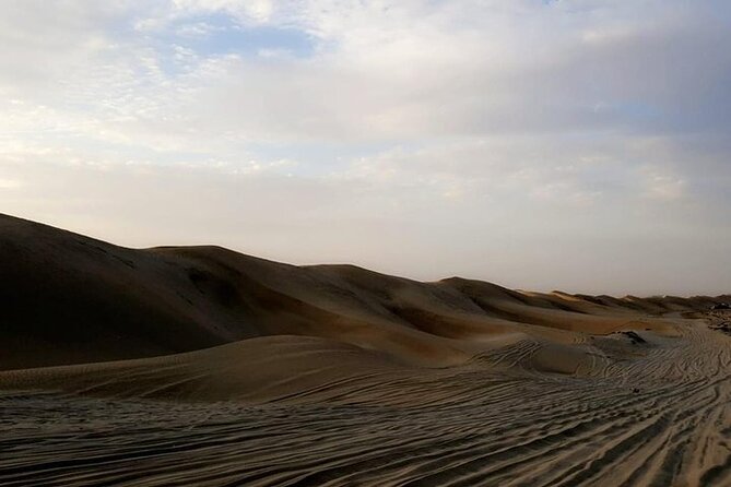 Qatar Sunset Desert Safari: Dune Bashing & Golden Sands Adventure - Sandboarding on the open sand