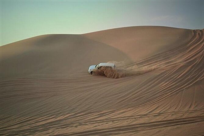 Qatar Sunset Desert Safari: Dune Bashing & Golden Sands Adventure - Two hours of dune bashing in a 4x4