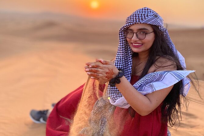 Red Dunes Desert Safari 4x4 Pickup & Drop, Camel Ride BBQ & Shows - Camel riding and sandboarding at the camp