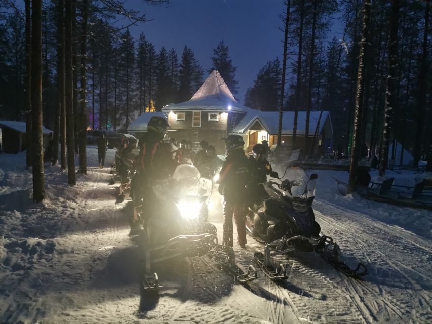 Rovaniemi: Aurora Borealis Snowmobile Safari with Campfire - Warming up beside the campfire