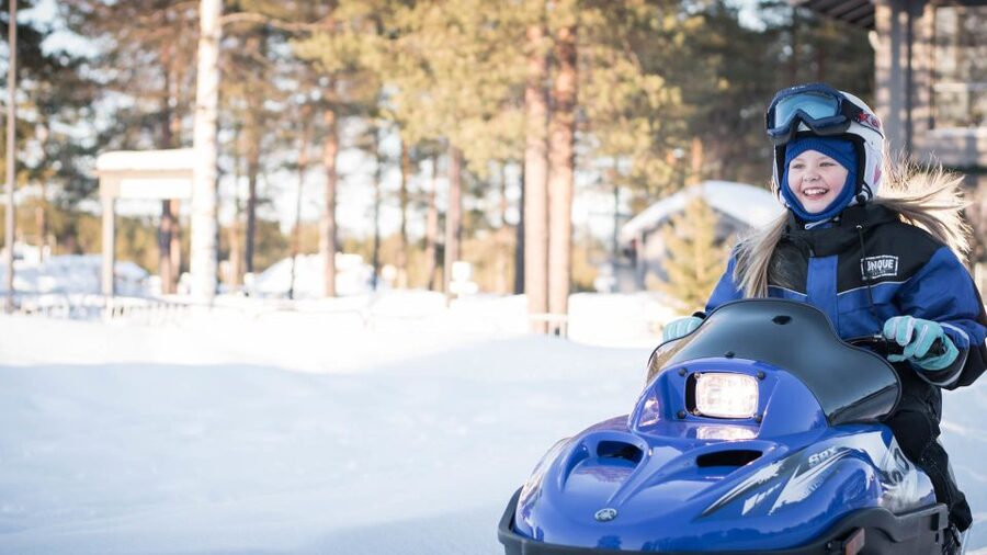Rovaniemi: Family Snowmobile Safari with Campfire and Snacks - A campfire with sausages, marshmallows, and berry juice