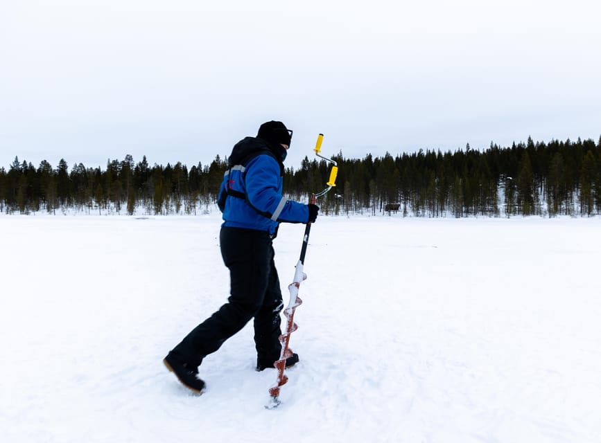 Saariselkä: Ice Fishing Safari by Snowmobile - A campfire lunch in the snow