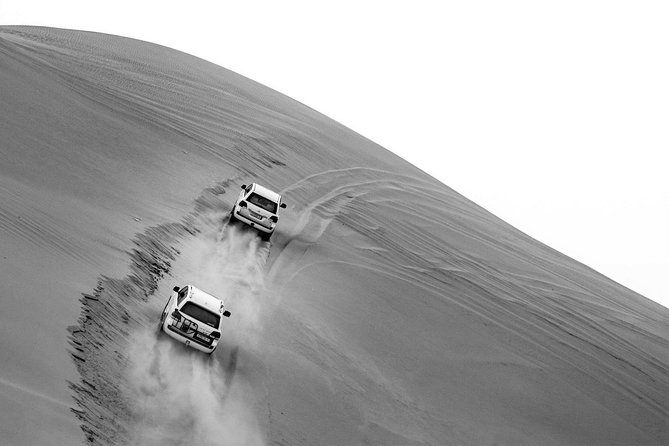Sharing or Private Safari, Sand Boarding, Camel Ride, inland Sea Quick swim - Dune bashing and sandboarding