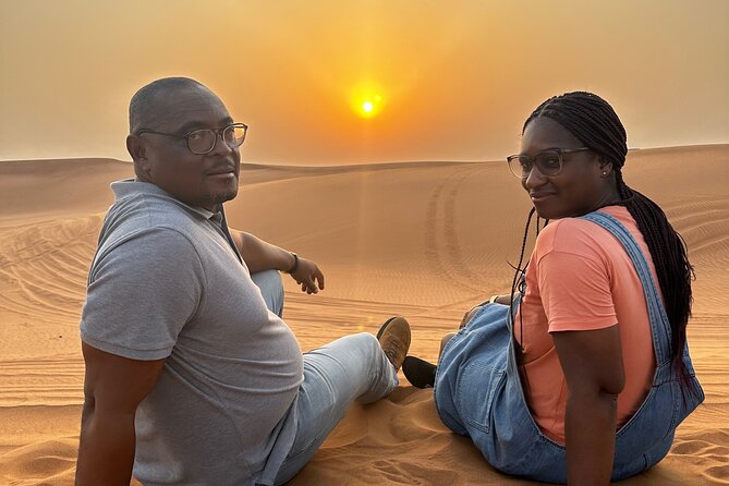 Sunset Desert safari with Camel Ride Sand Board & BBQ Dinner - Pickup, group size, and the rhythm of the evening